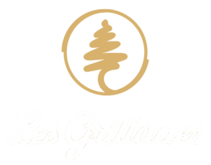 Les Grillades transparent logo with cursive lettering and cedar tree symbol representing authentic Lebanese restaurant in Ottawa.